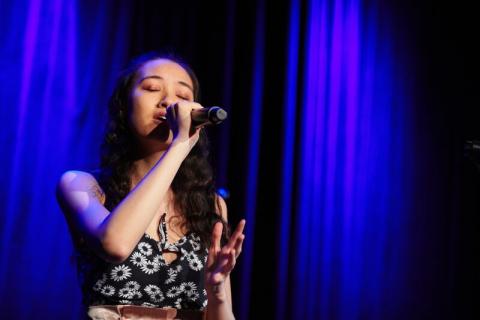 Girl singing on stage