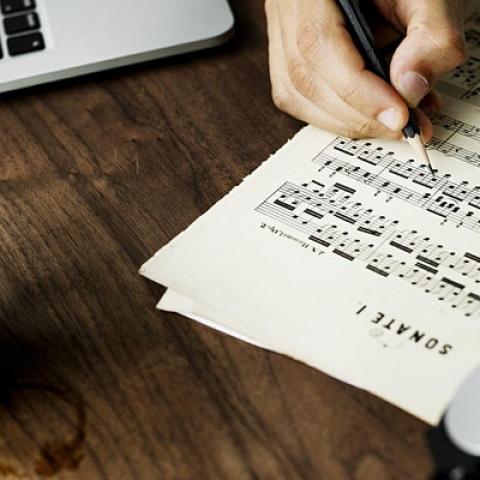 sheet music, coffee and laptop