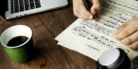 sheet music, coffee and laptop