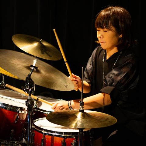 Student playing the drums