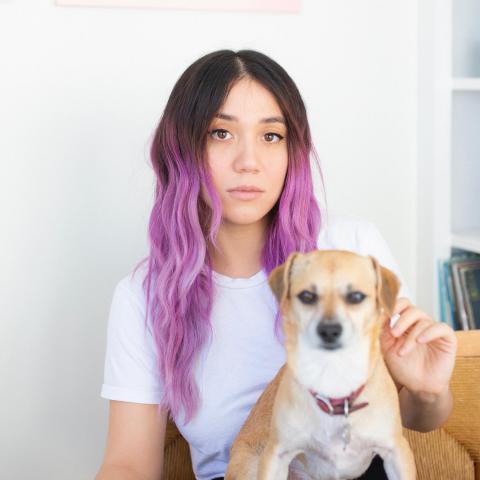 Weezer producer Suzy Shinn in her home with her dog