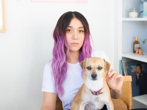 Weezer producer Suzy Shinn in her home with her dog