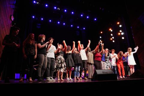 Students bowing after performance