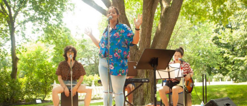 Trio performing outdoors